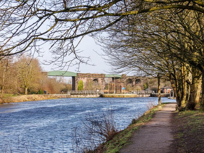 Railway bridge over the River Weaver with locks in the foreground