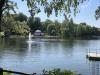 View across a lake to the bandstand